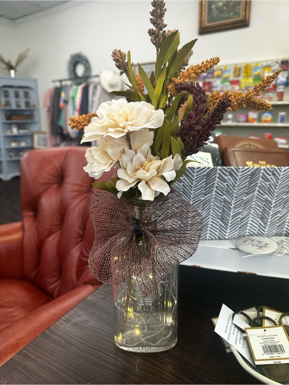 Fall Floral Arrangement up cycled old rubbing alcohol bottle with twinkle lights